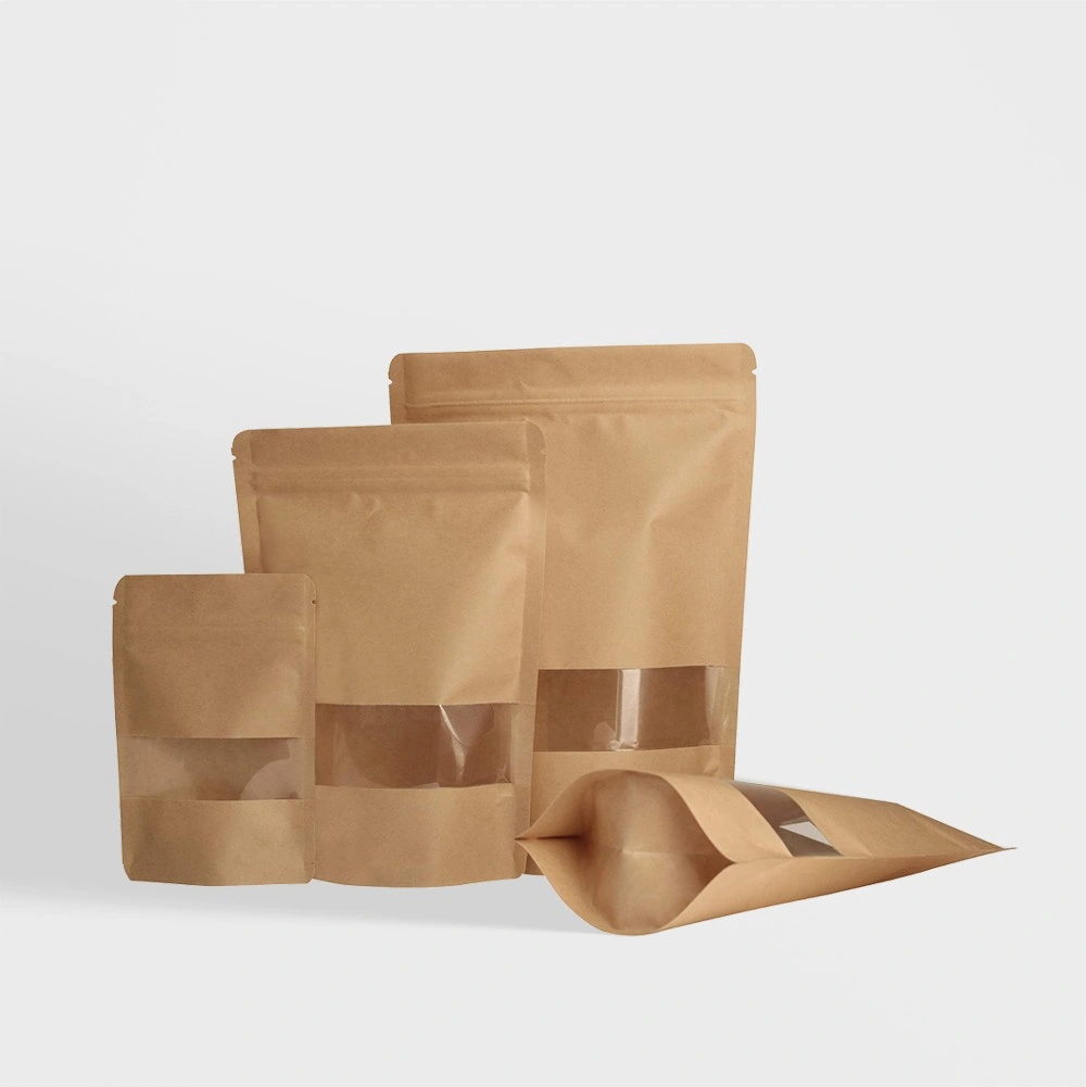 Kraft Stand-Up Pouches with Window | The Packaging Base Kraft stand-up pouches with a clear window, ideal for showcasing and packaging food and retail products.