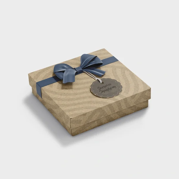 Eco-Friendly Kraft Paper Gift Box with Lid and Ribbon | The Packaging Base Square kraft gift boxes with navy ribbon and scalloped tag
