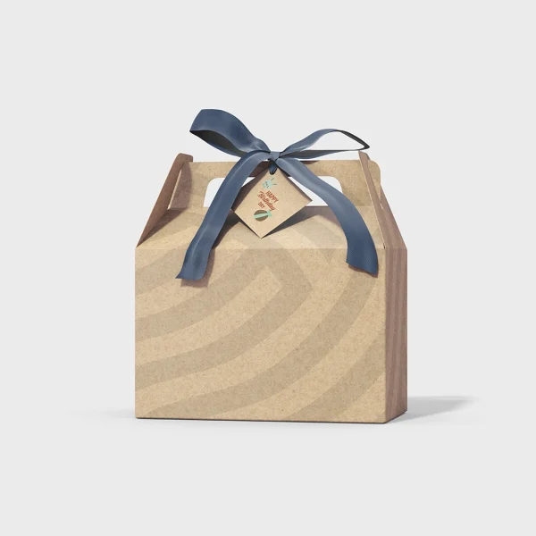 Eco-Friendly Kraft Paper Gift Box with Handle and Ribbon | The Packaging Base Eco-friendly kraft paper gift box with navy blue ribbon and floral gift tag
